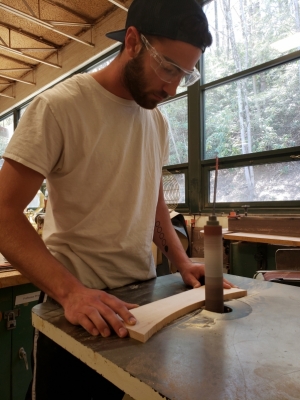 Sam Somerville works on his tea cabinet